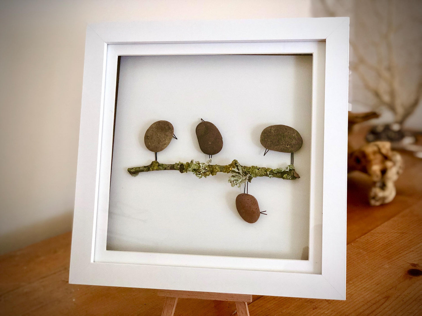 Custom made pebble art picture, driftwood and flower art, Box Framed 18x18cm featuring Naughty Bird and Family