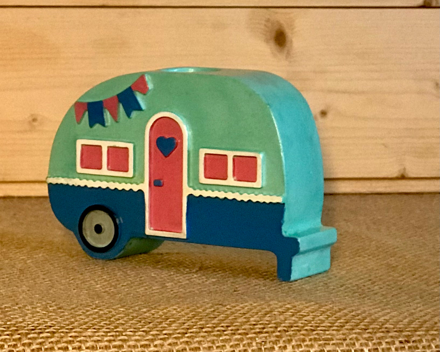 Campervan candle holder with a showing the front , with a glossy sheen & Turqoise hand mixed ceramic pigment.