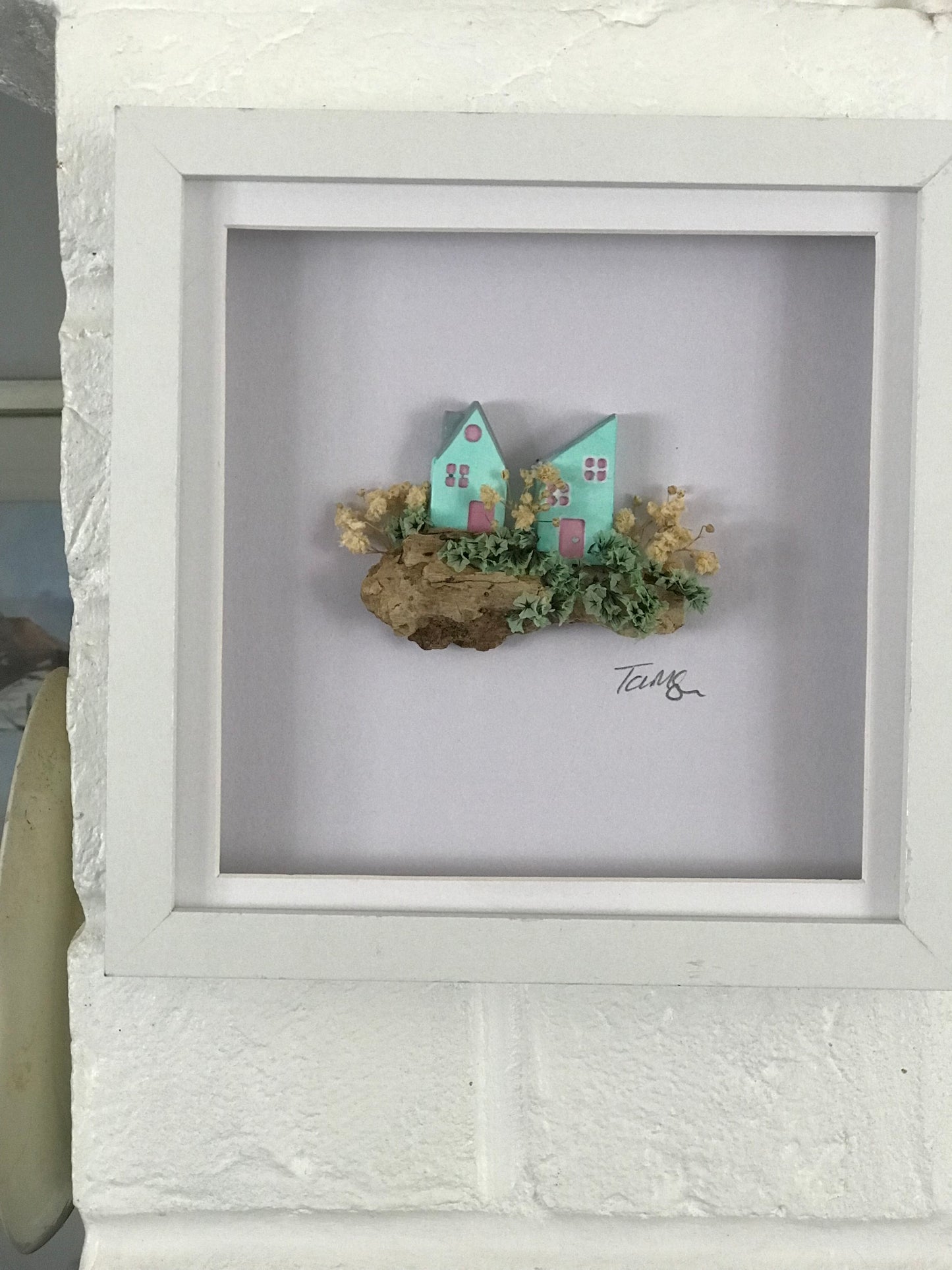 Miniature Turquoise Clay Houses Art – Framed Driftwood Scene with Wild Flowers (18x18cm)