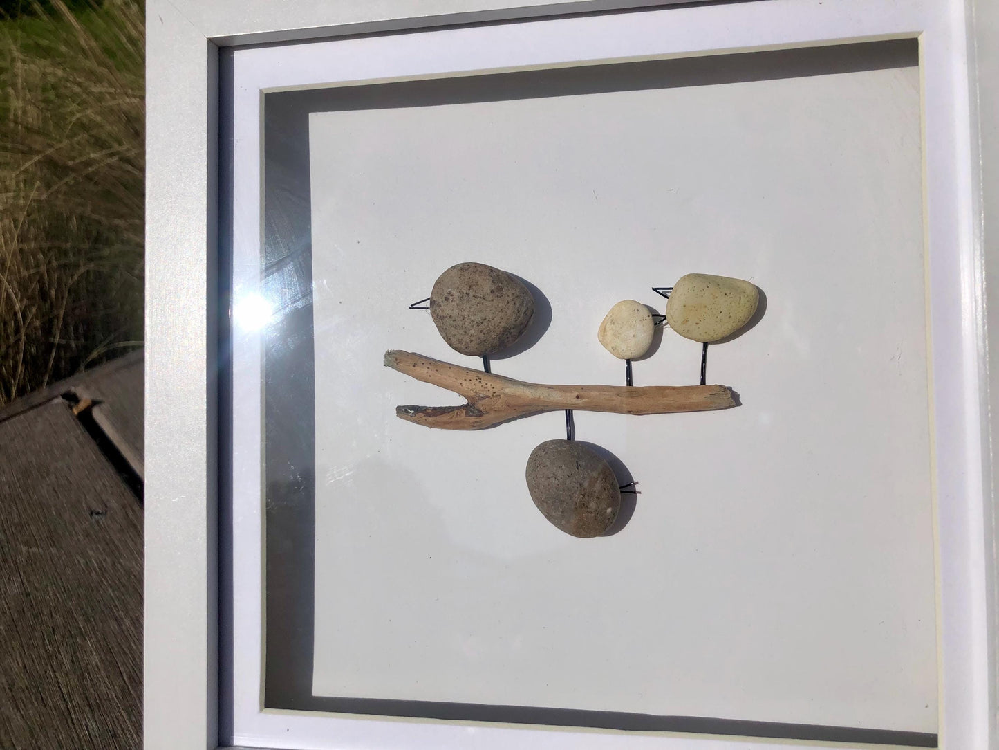 Custom made pebble art picture, driftwood and flower art, Box Framed 18x18cm featuring Naughty Bird and Family