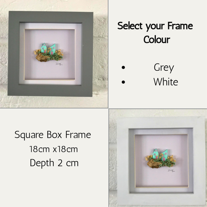 Miniature Turquoise Clay Houses Art – Framed Driftwood Scene with Wild Flowers (18x18cm)