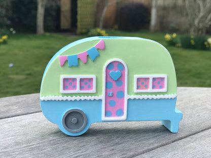 Campervan candle holder in baby blue and green colorway with pink door, showcasing the customizable color options available.