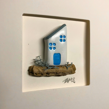 Side profile of framed handmade coastal cottage card showing depth of the aperture and three-dimensional driftwood base